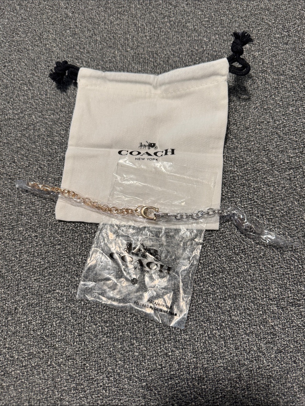 Gold and silver Coach bracelet